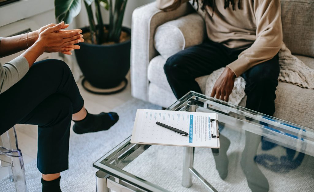 accountant meeting with his client while his notes is on the table