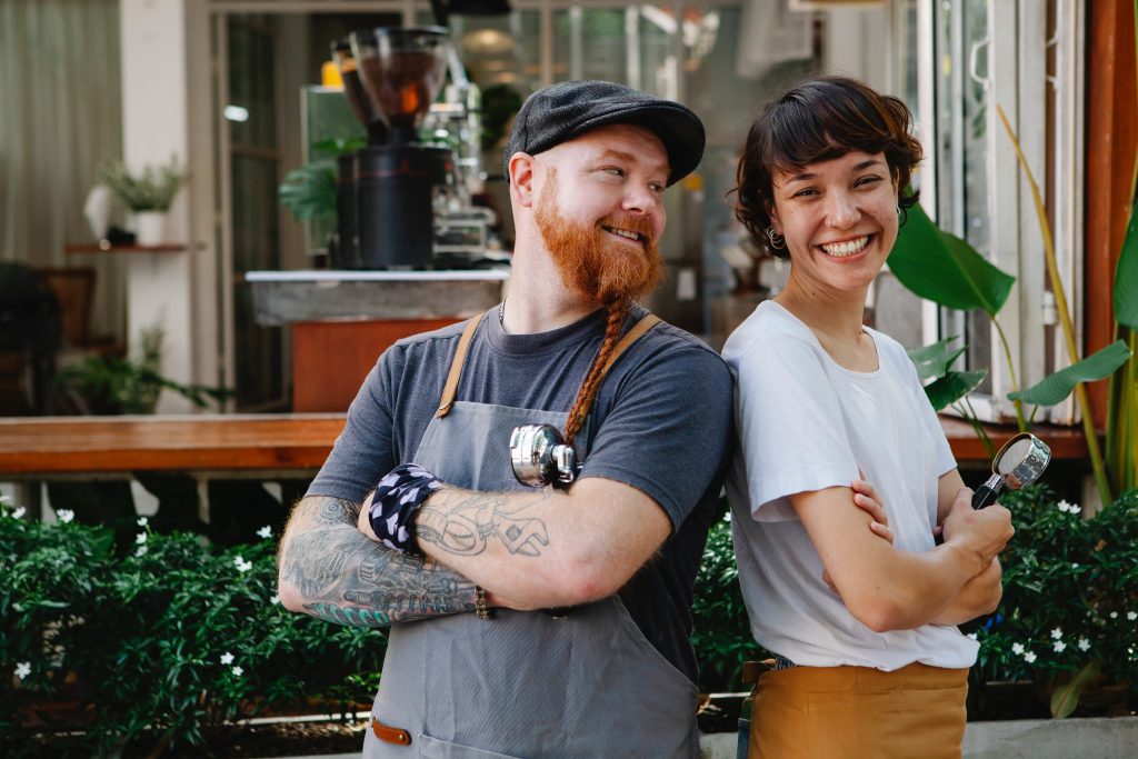 smiling husband and wife happy with their business