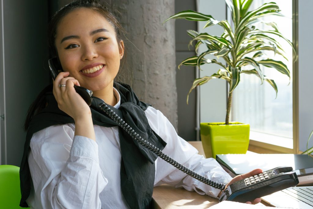 accountant happily taking a client call