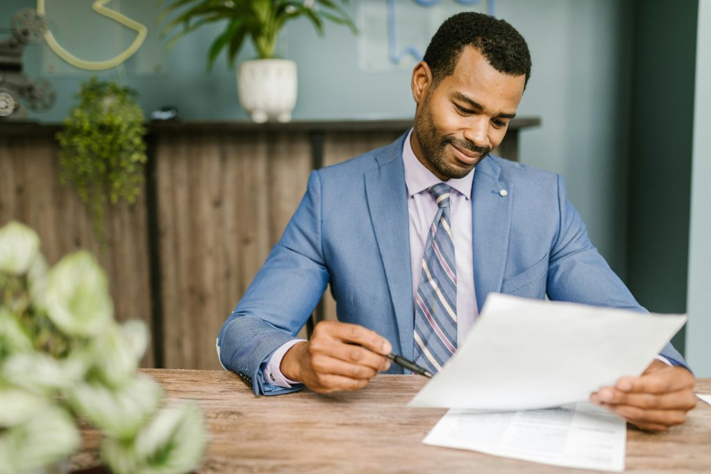 accountant checking information on the paper