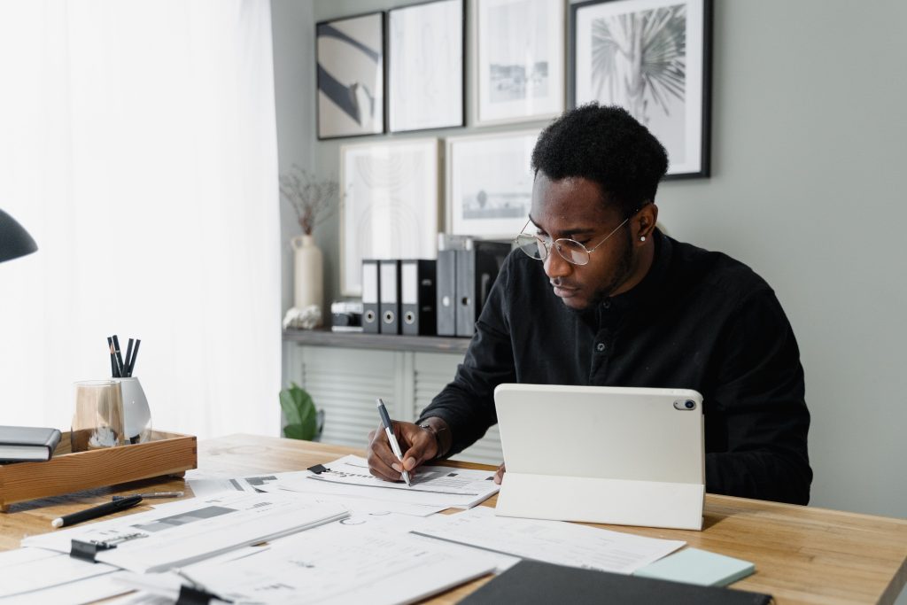 accountant writing his reports using a laptop