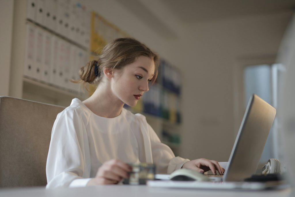 accountant working on tax returns on her laptop