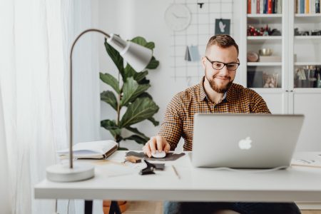 accountant working on a macbook laptop