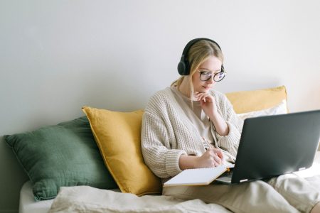 accountant sitting on a couch working from home