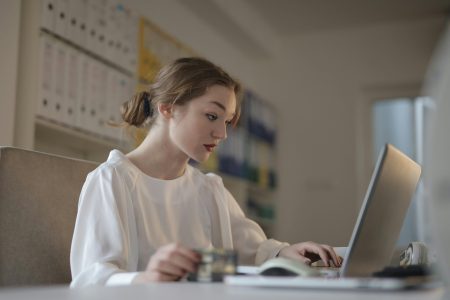 accountant working on tax returns on her laptop