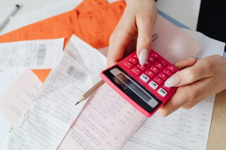 computing tax return using red calculator