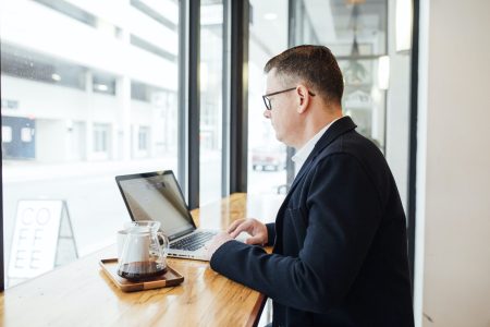 accountant working by the window on a coffee shop