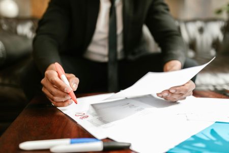 accountant double checking the details on his paper