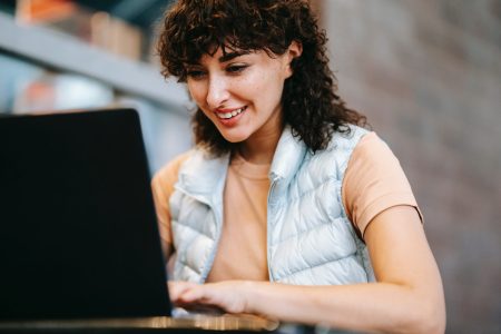 portrait shot of a female accountant working with her laptop