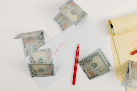 paper bills notes and a pen