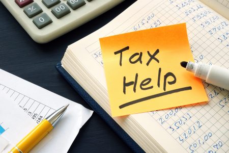 Tax help memo and financial calculations with calculator.